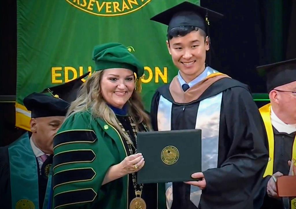 Arthur Xia with Fitchburg State University President Donna Hodge