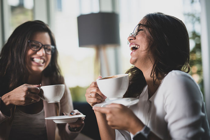 two people drinking coffee