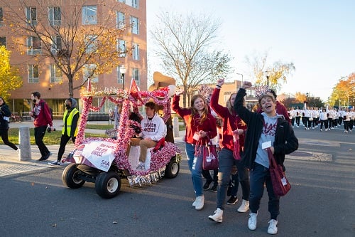 students with decorated golf cart