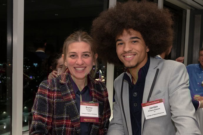 Two people looking at camera at networking event