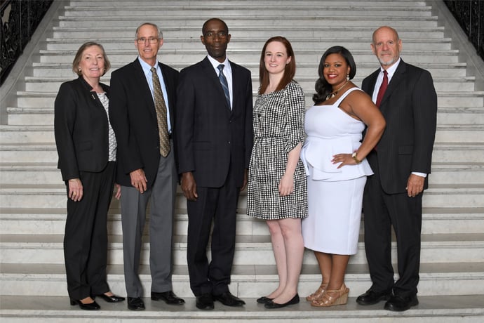 UMass Alumni Award Recipients standing on the steps of the state house