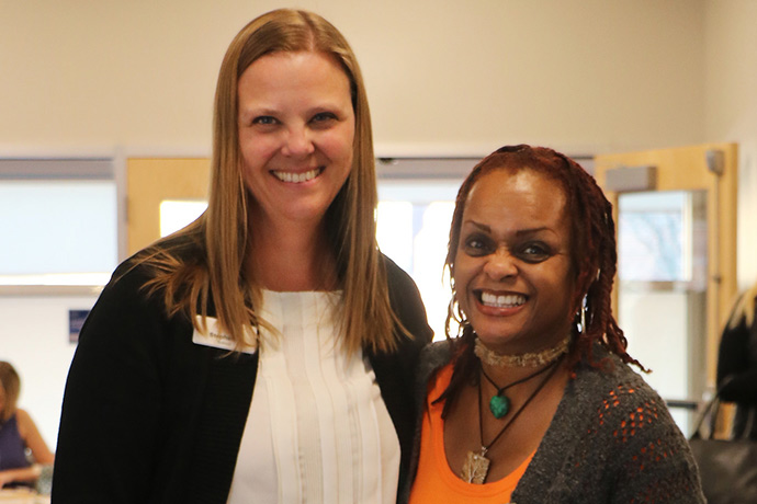 Alumni employers attend a career fair on campus