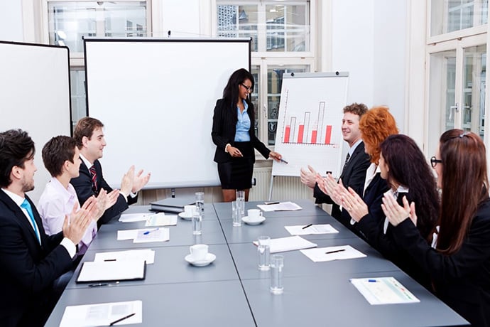 Woman giving presentation to group